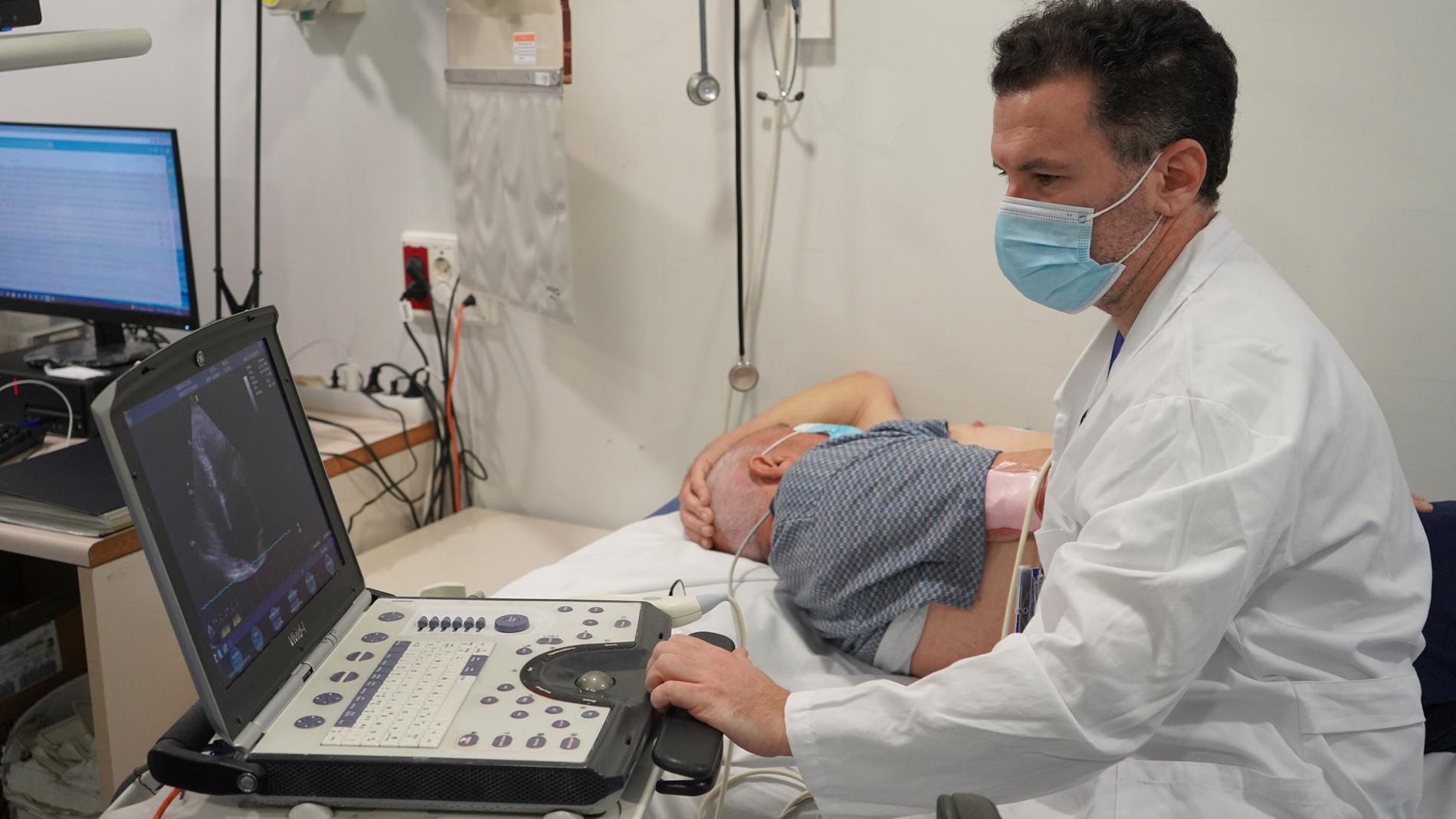Dr. Jorge Pagola performing a cardiac ultrasound on a stroke patient
